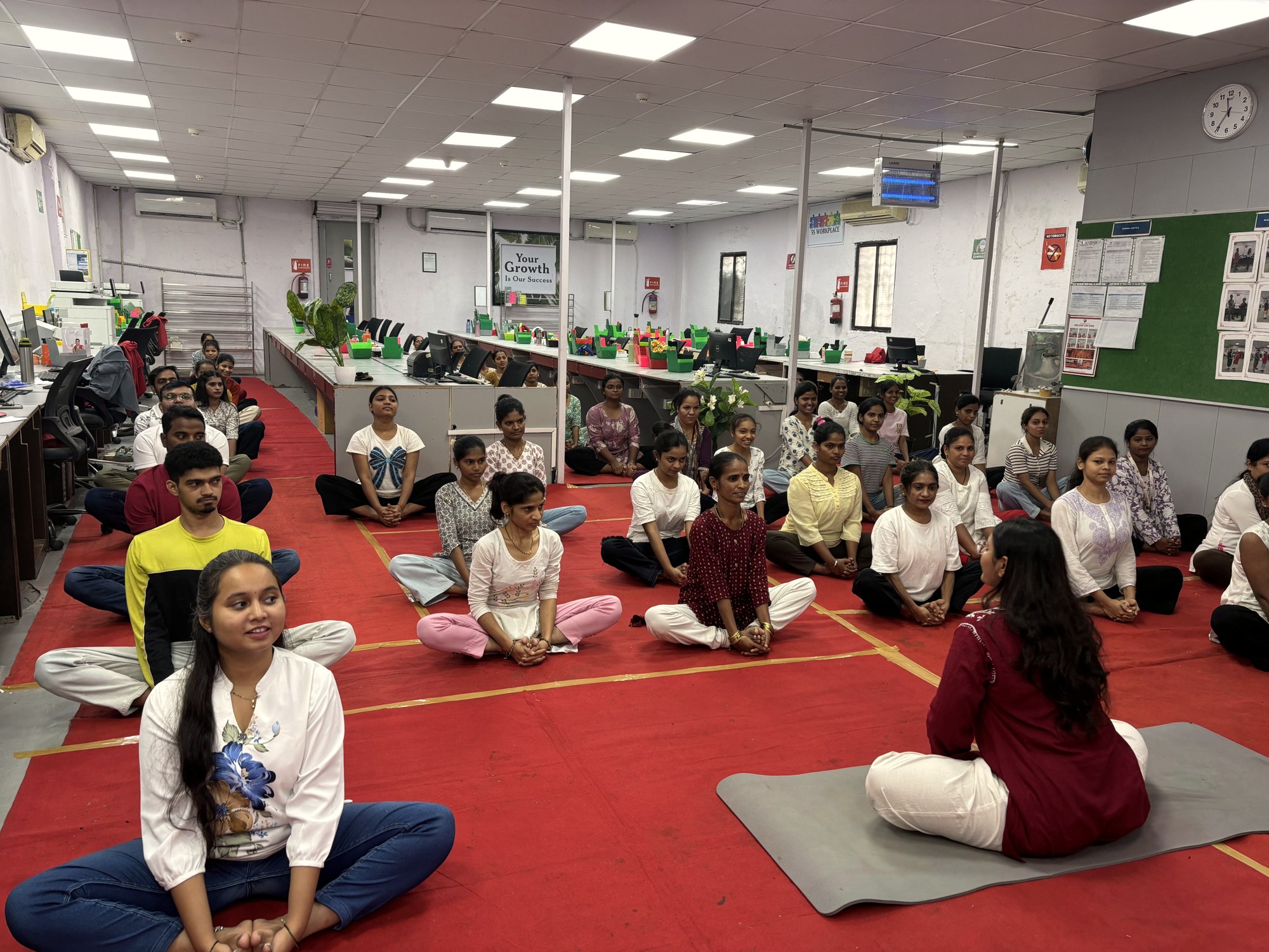 A corporate yoga session led at Illusion Lab